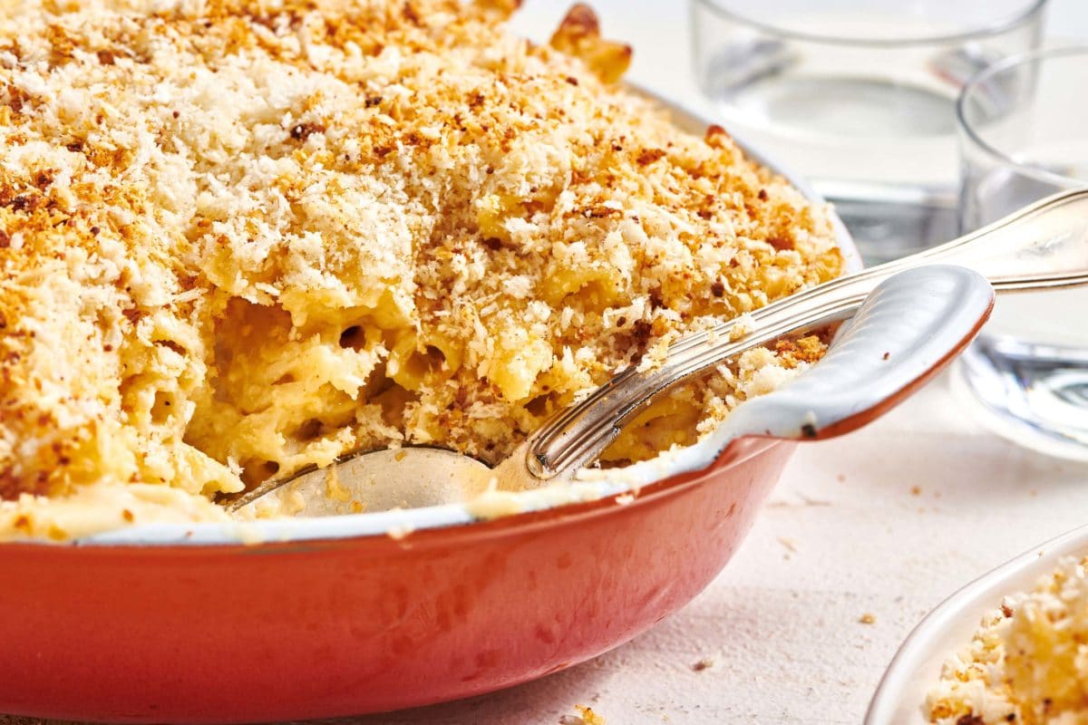 Baked Macaroni and Cheese in red baking dish.