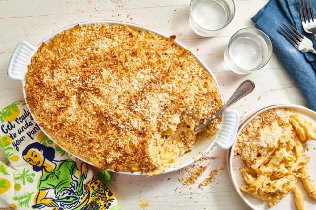 Baked Macaroni and Cheese in a baking dish with a spoon.