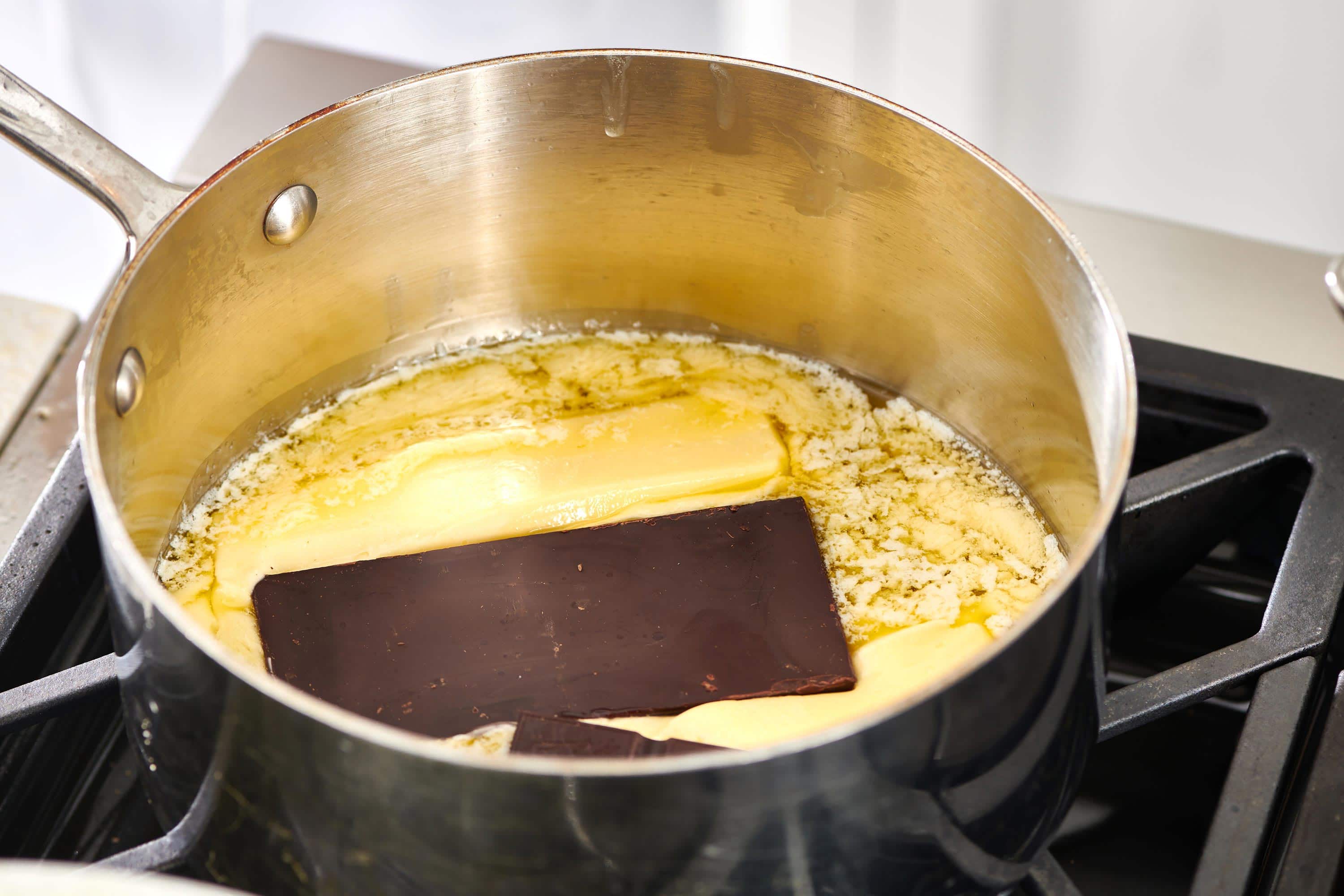 Melting butter and chocolate for brownies in saucepan.