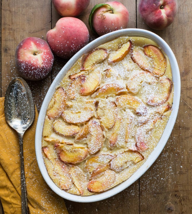 A Peach Clafoutis in an oblong bowl.