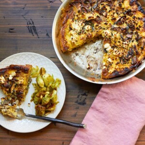 Mushroom, Caramelized Onion and Feta Frittata in a pan and on a plate.