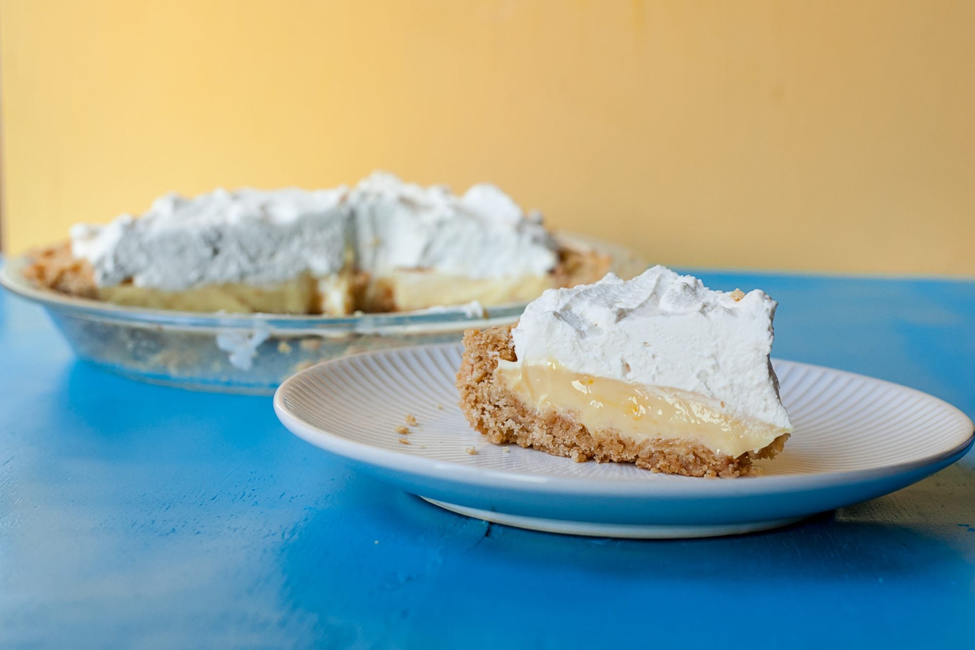 Slice of Atlantic Beach Pie on plate with full pie plate in background.