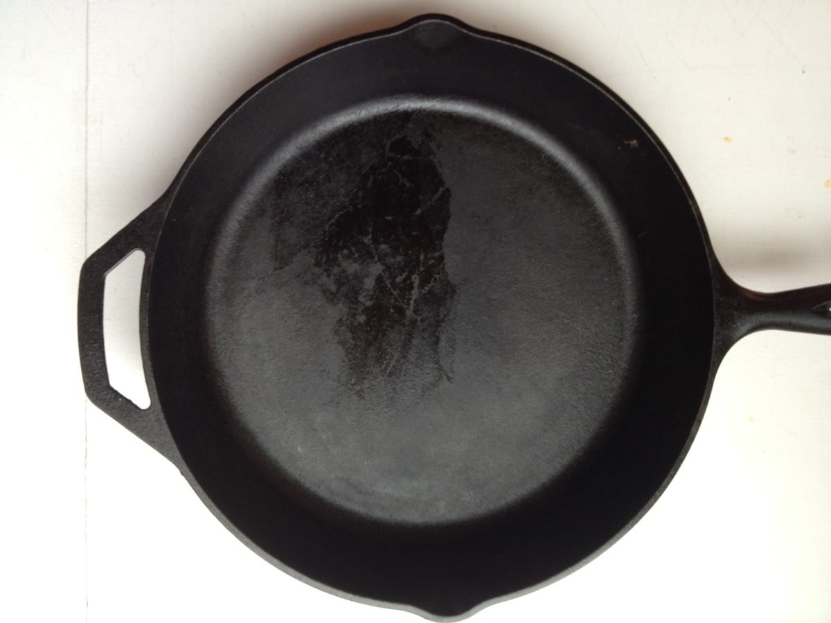 Cast iron skillet on a white surface.