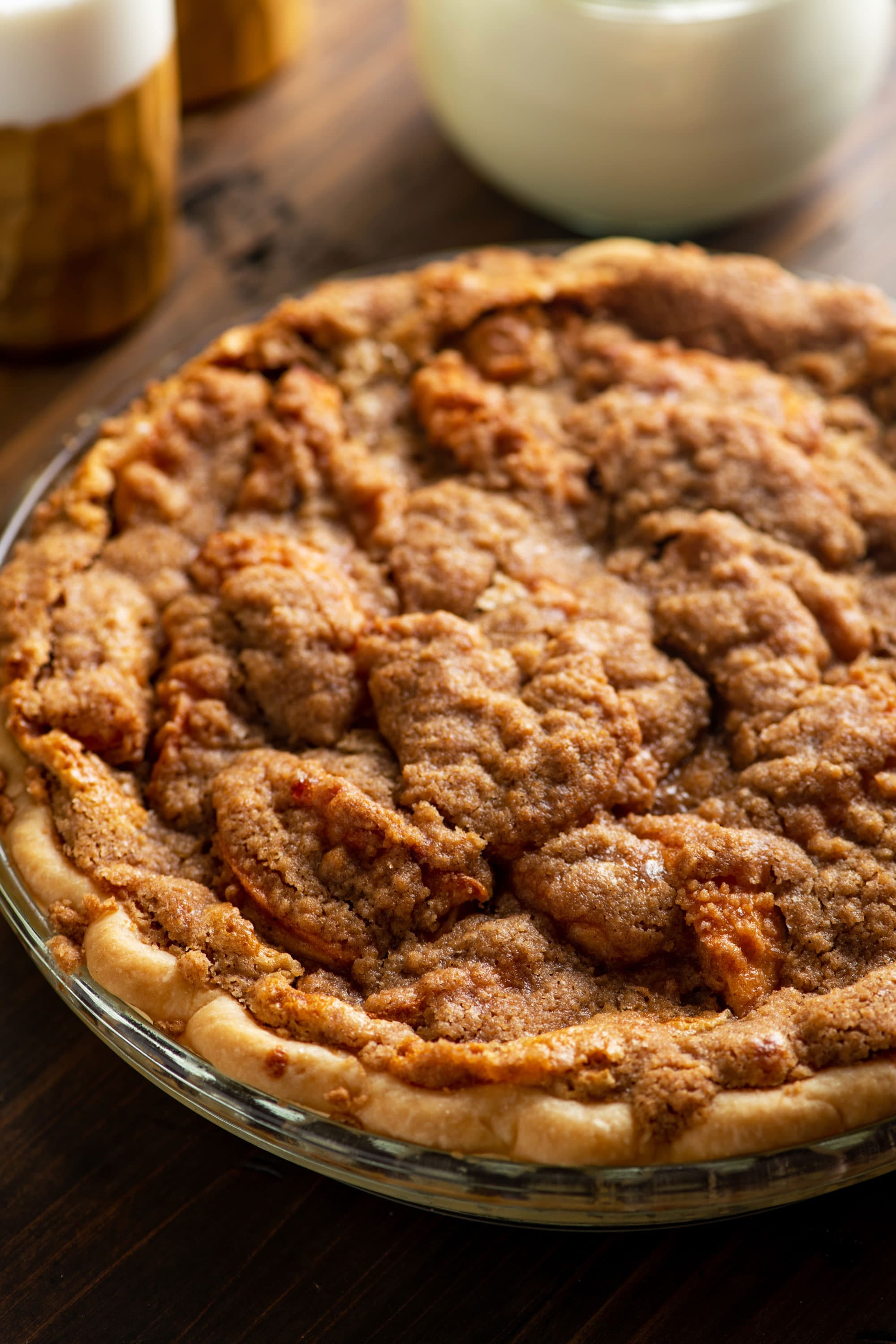 Streusel Apple Pie in a glass pie pan.