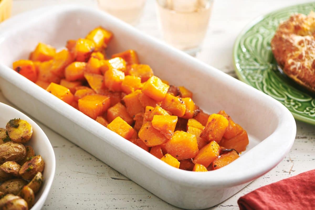 Roasted Butternut Squash in a white serving dish.