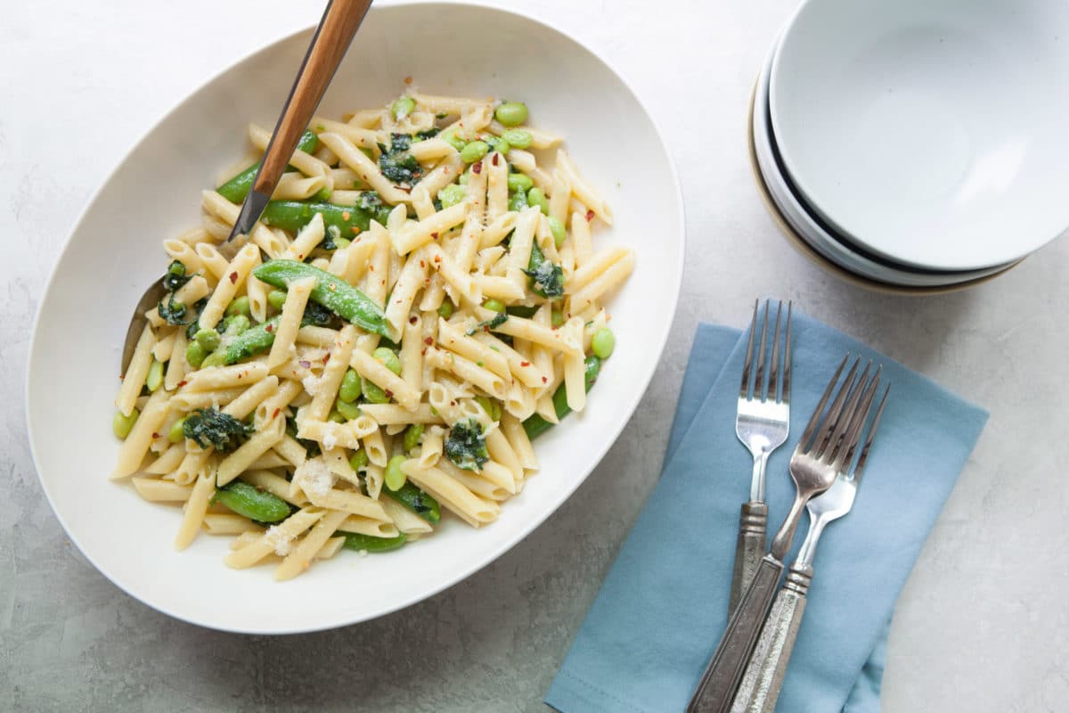 Pasta with Ramps, Edamame, and Sugar Snap Peas in a Light Parmesan Cream Sauce / Photo by Kerri Brewer / Katie Workman / themom100.com