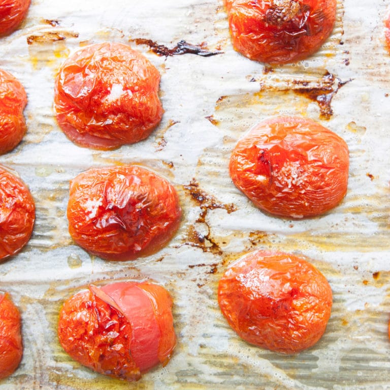 Lined baking sheet of Roasted Tomatoes.