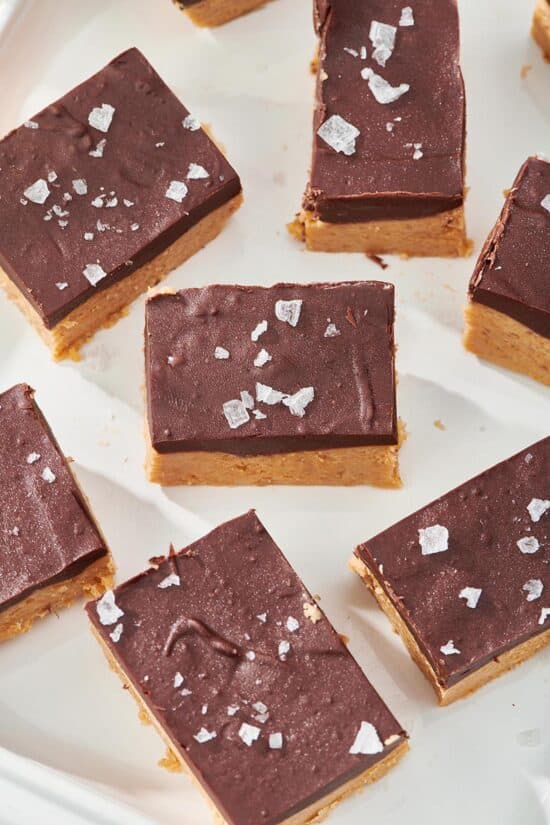 Chocolate Peanut Butter Bars on a white surface.