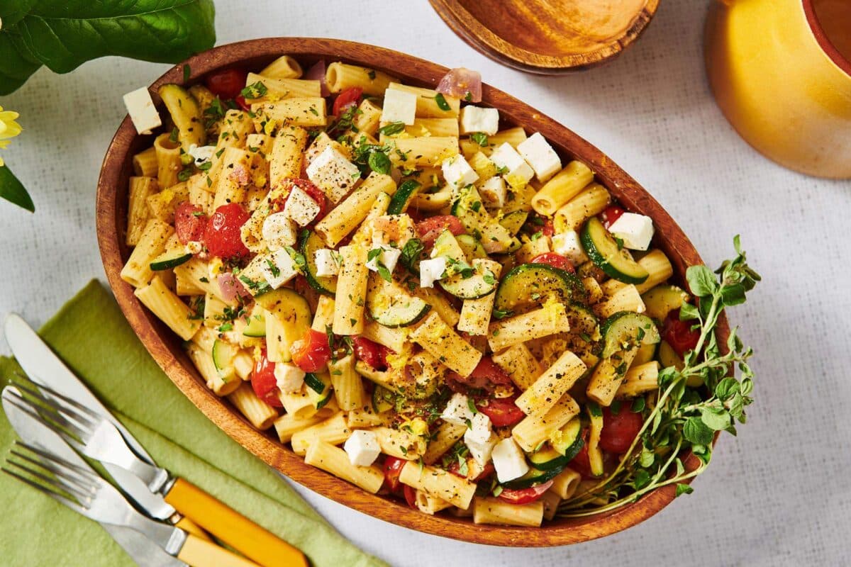 Vegetarian Greek Pasta Salad in serving platter on table.