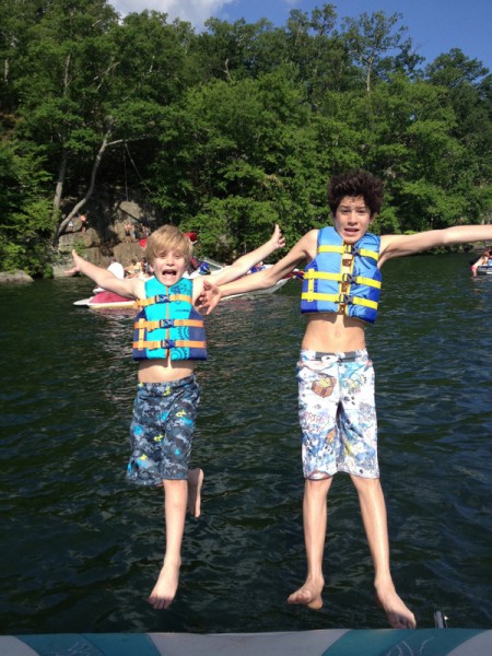 Charlie and a friend jumping off boat.