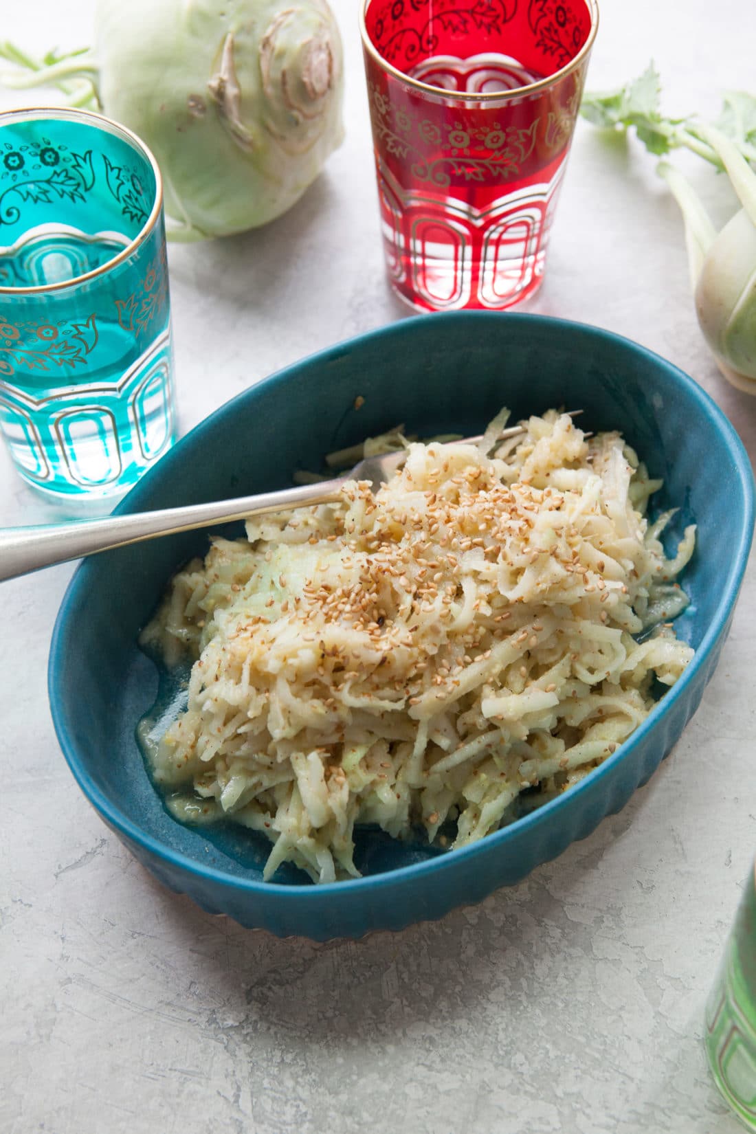 Blue dish of Asian Kohlrabi and Apple Slaw.