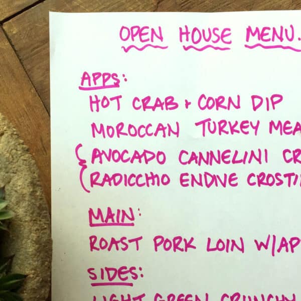 Holiday Open House menu printed on paper in pink ink.