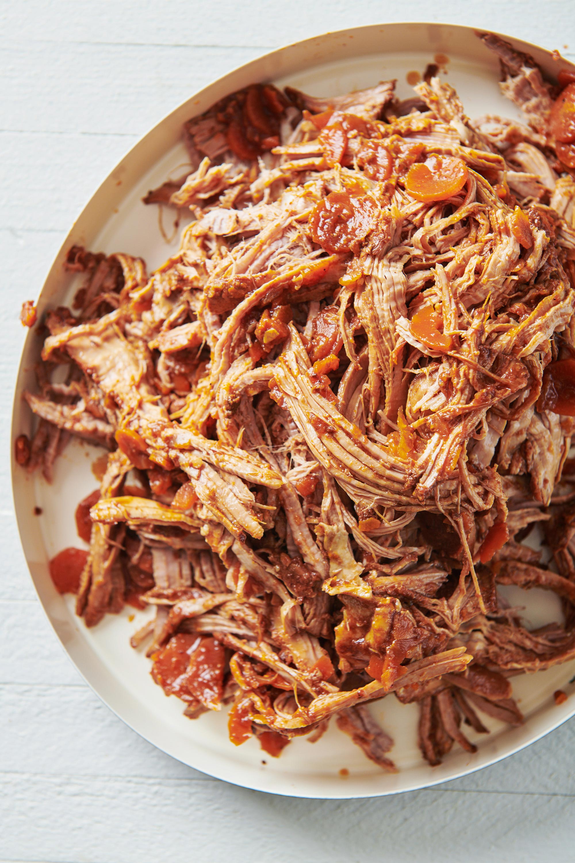 Slow Cooker Barbecue Pulled Pork in a white serving plate.