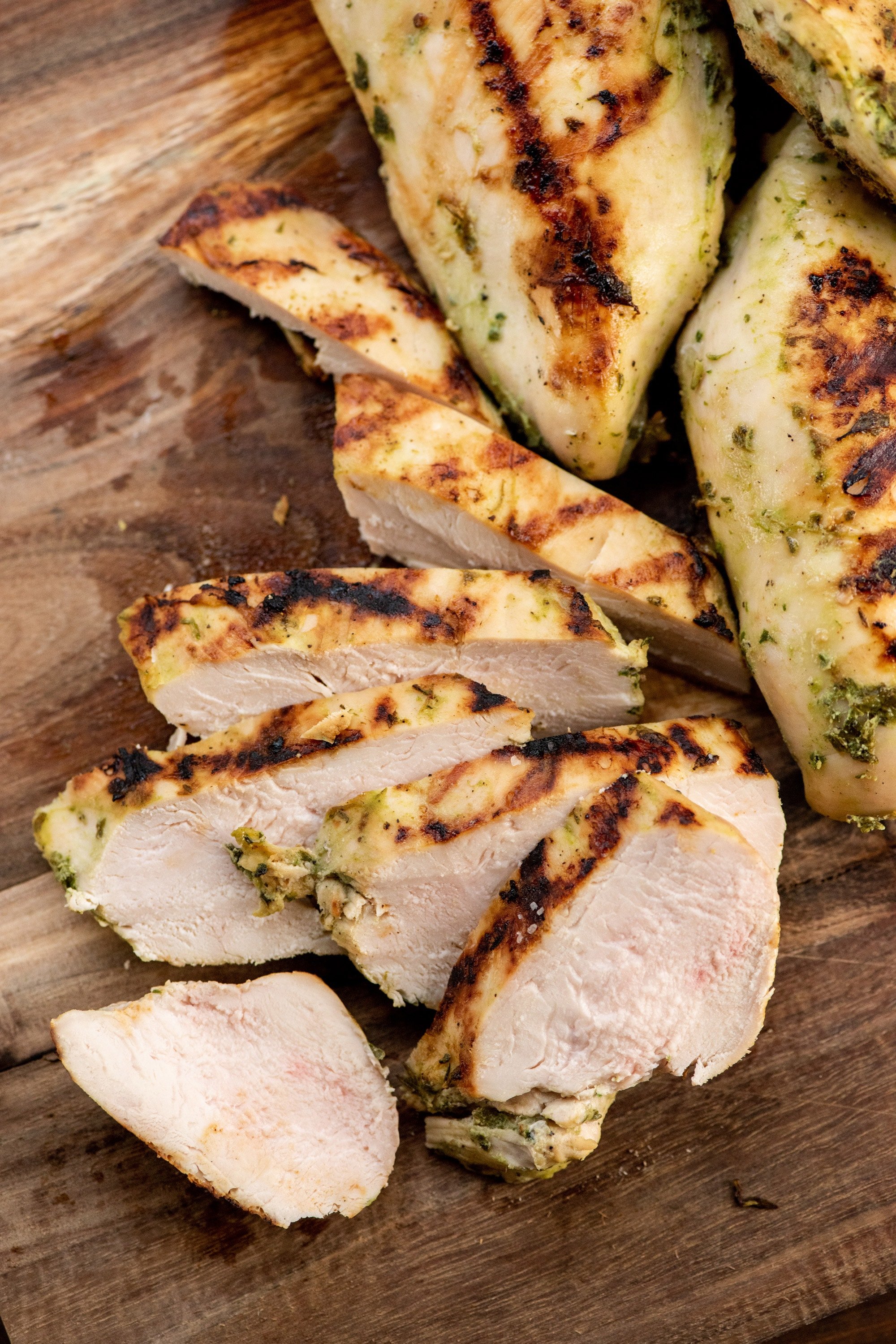 Slices of Grilled Chicken Breasts with Lime, Roasted Garlic and Fresh Herb Marinade.