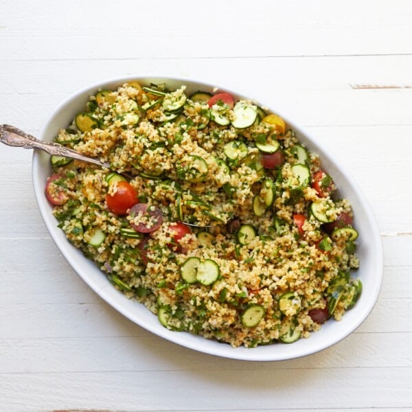 Tomato, Zucchini and Bulgur Salad in bowl with spoon.