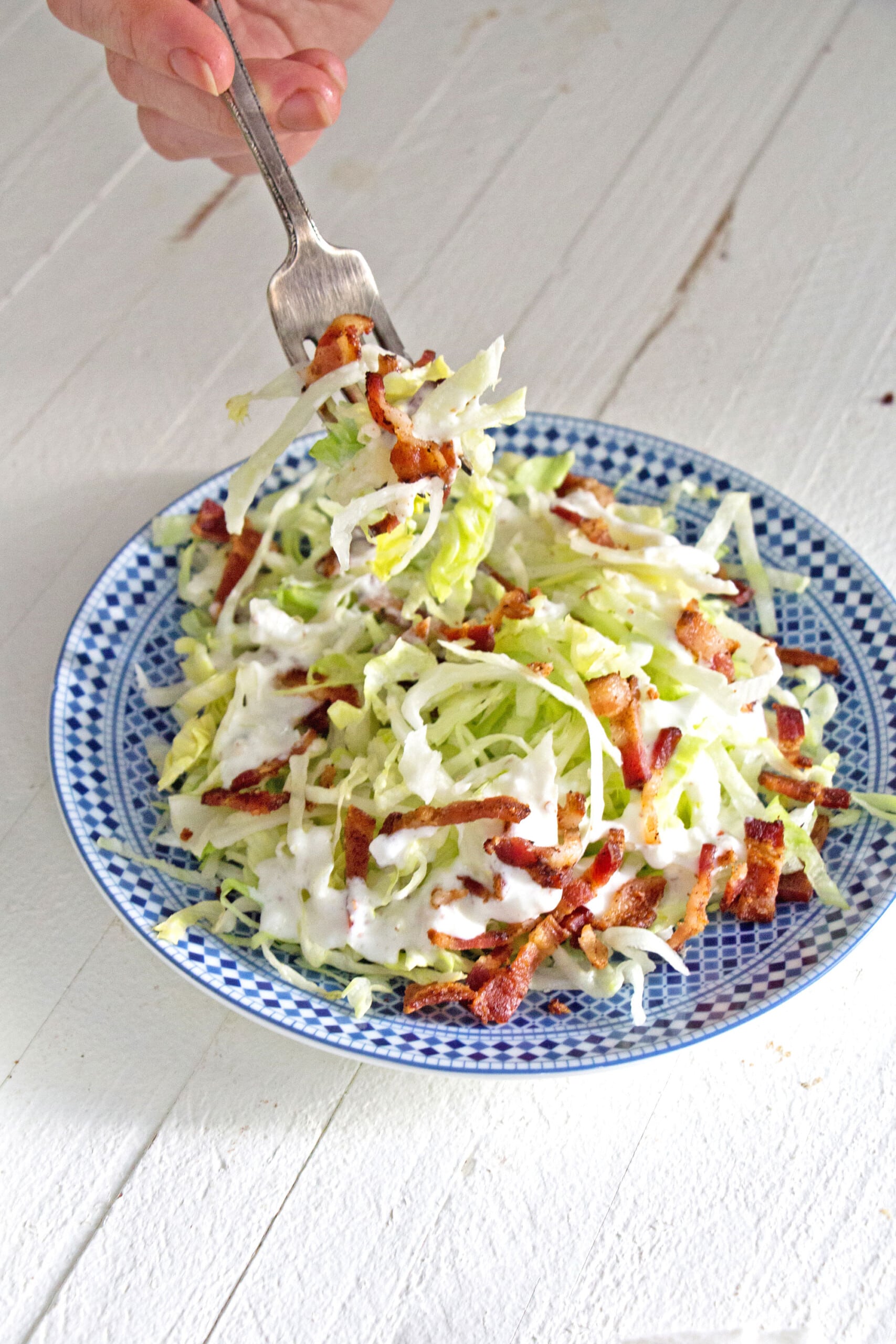 Bowl of salad with bacon and buttermilk dressing