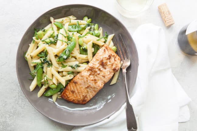 Gray plate featuring Horseradish Ginger Salmon and pasta with sugar snap peas
