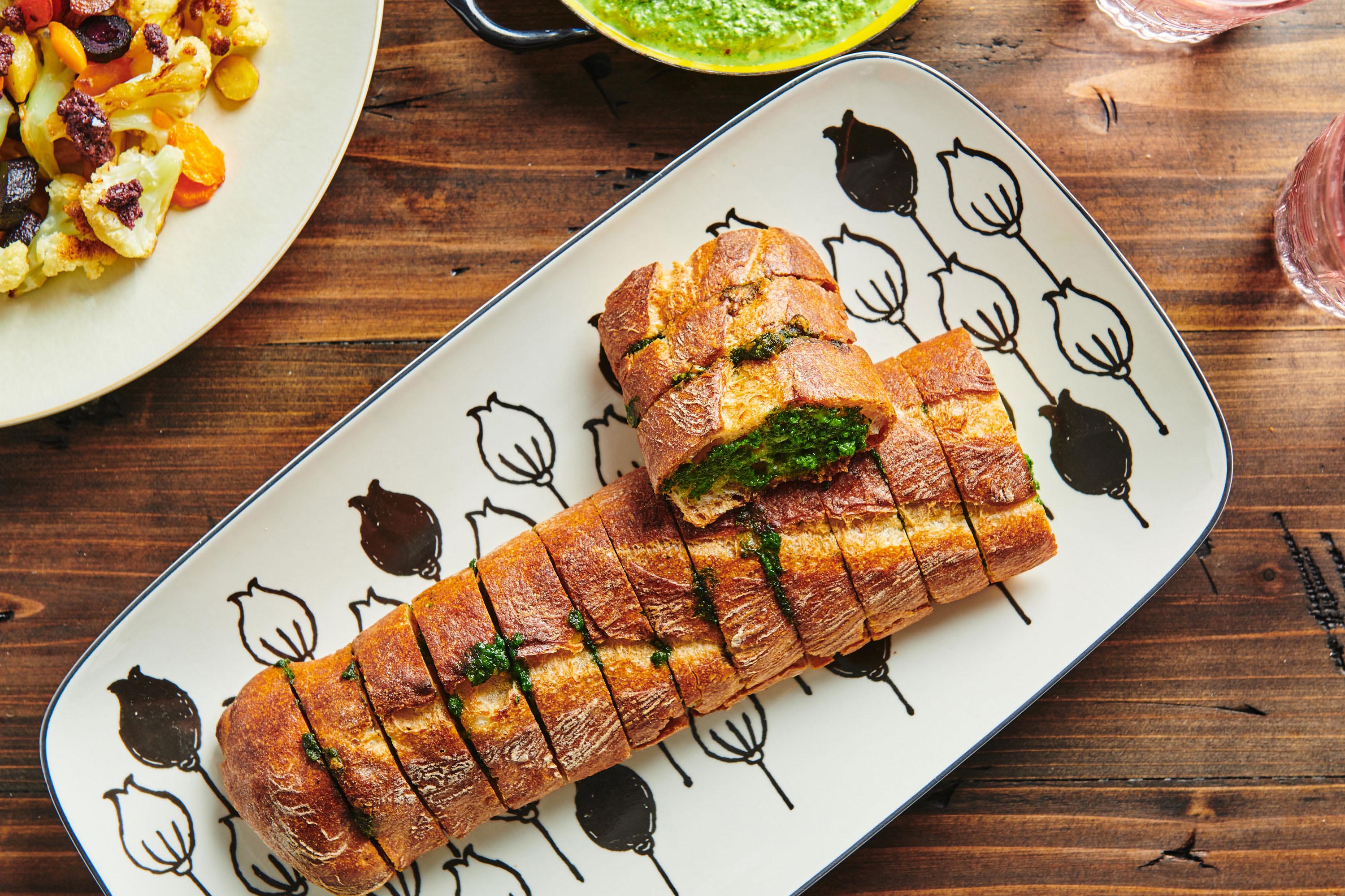 Spinach Parsley Pesto Garlic Bread on white serving platter.