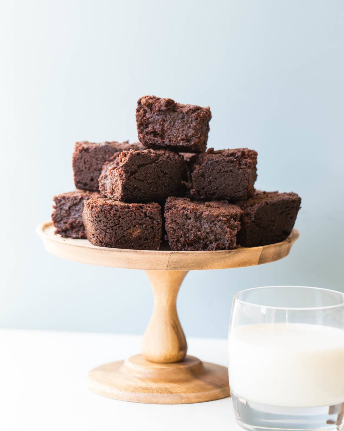 Pile of Mexican Hot Chocolate Brownies on an elevated serving platter.