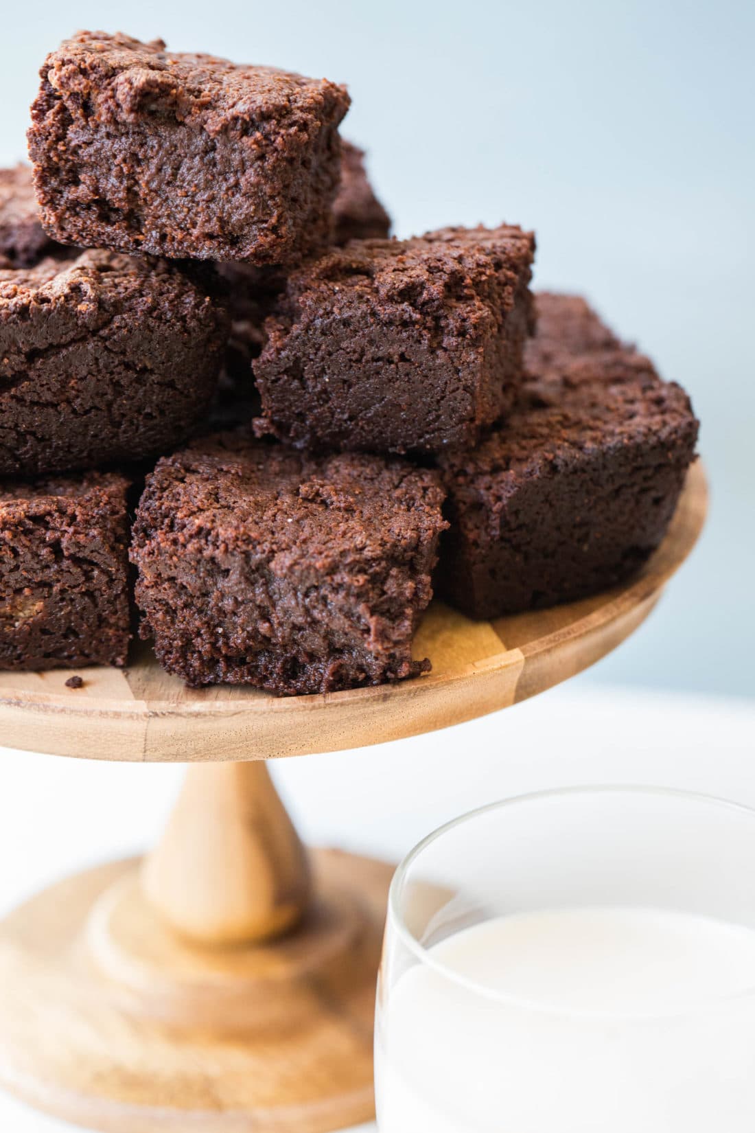 Wooden serving dish of Mexican Hot Chocolate Brownies.