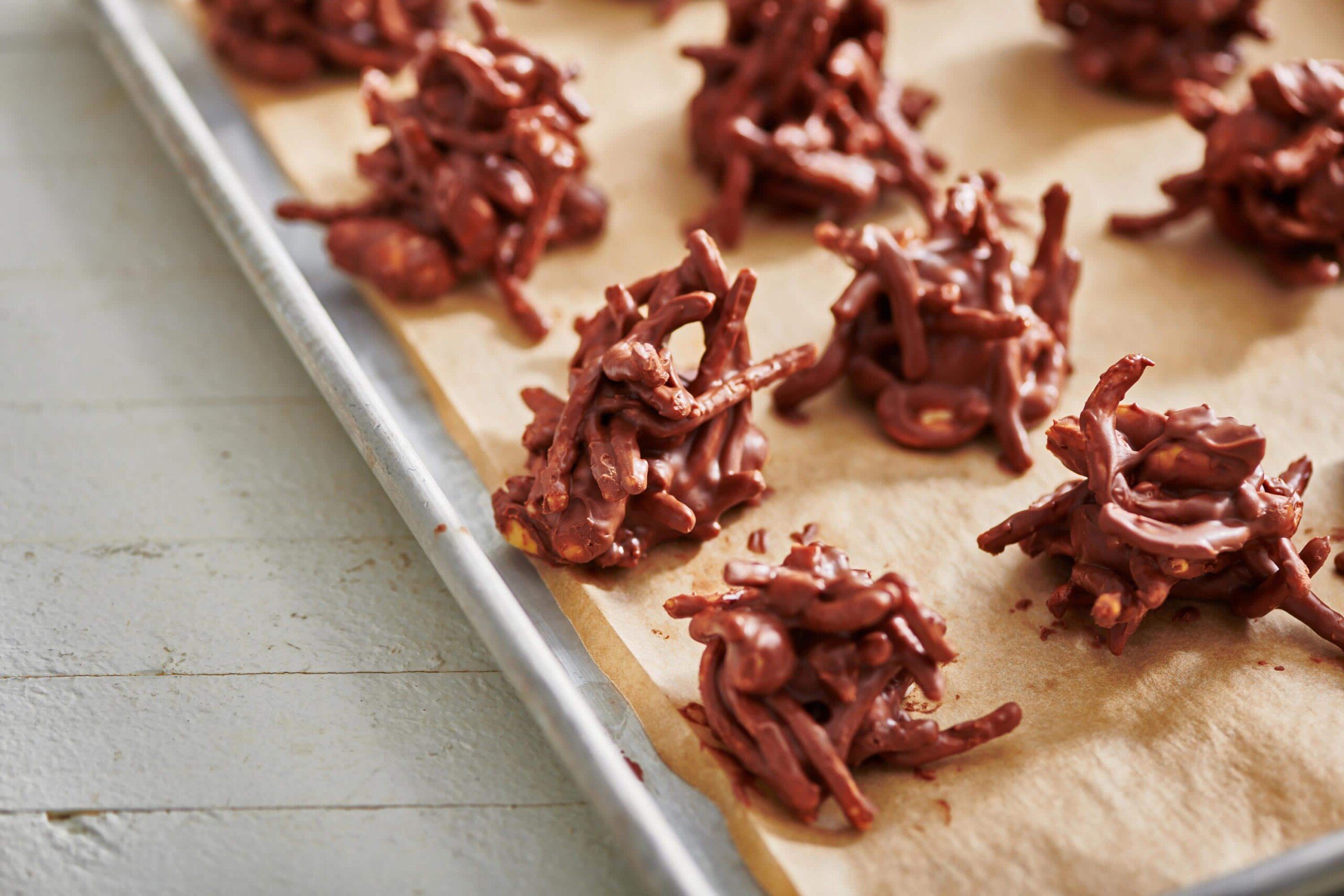 Haystack cookies on parchment paper lined baking sheet.