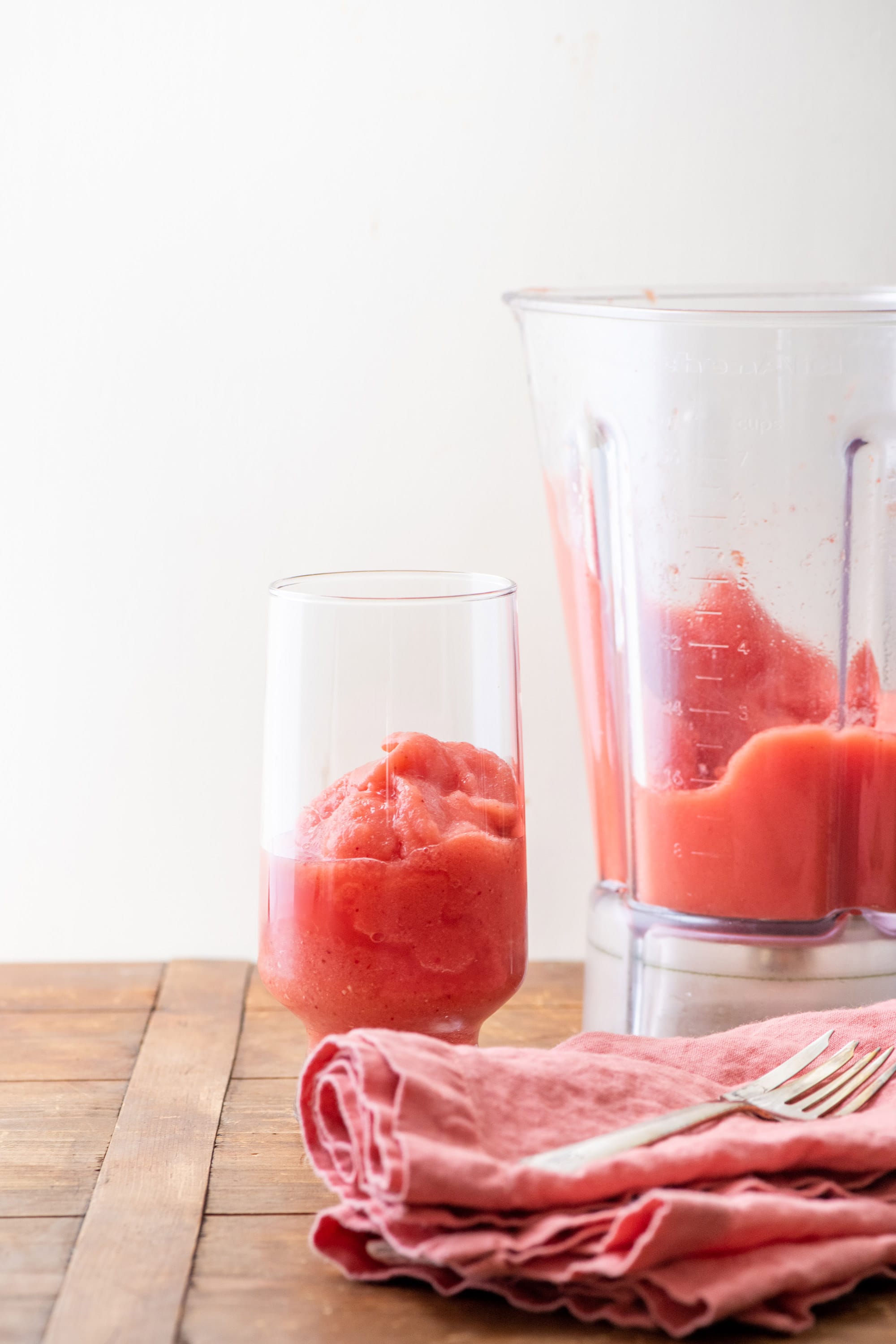 Glass and blender of Watermelon Strawberry Smoothie.