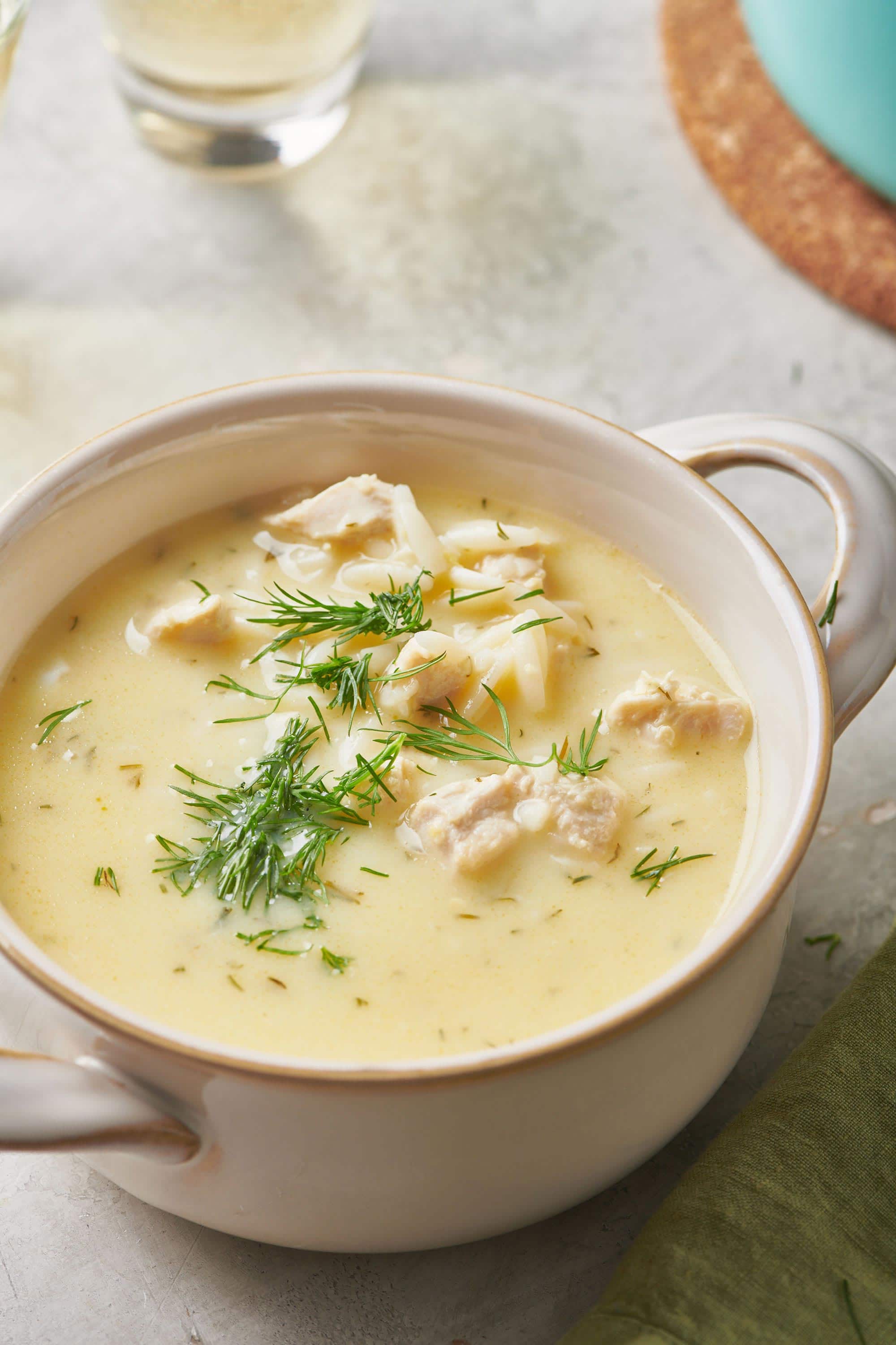 Avgolemono Soup in a small, handled bowl.