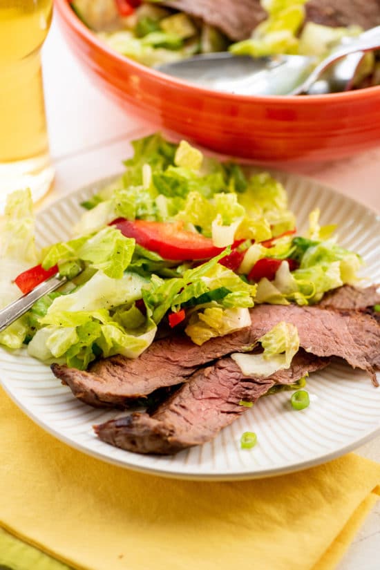 Smoky Sweet Thai Grilled Flank Steak Salad on a small white plate.