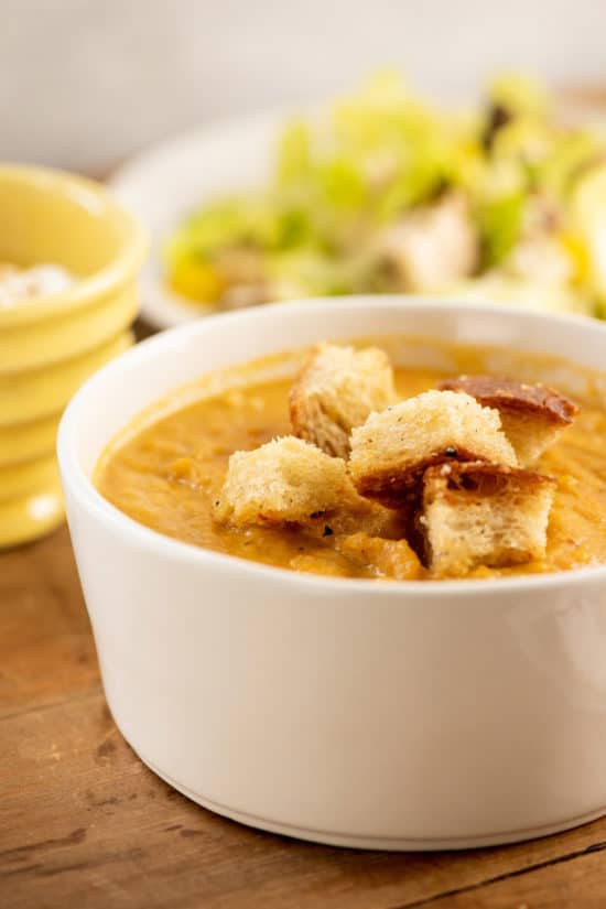 Closeup of Spicy Roasted Root Vegetable Soup with Parmesan Croutons