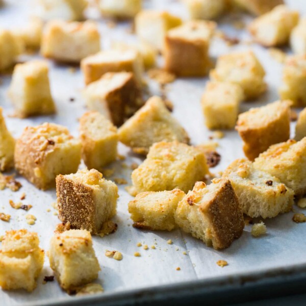 Parmesan Croutons on a lined baking sheet.