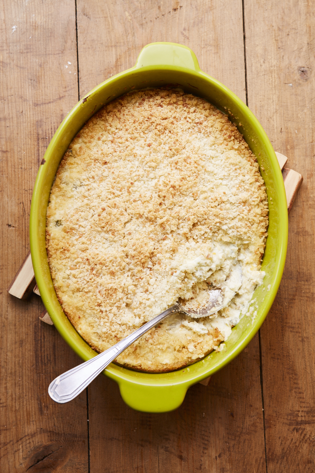 Hot Jalapeno Popper Dip in a green baking dish.