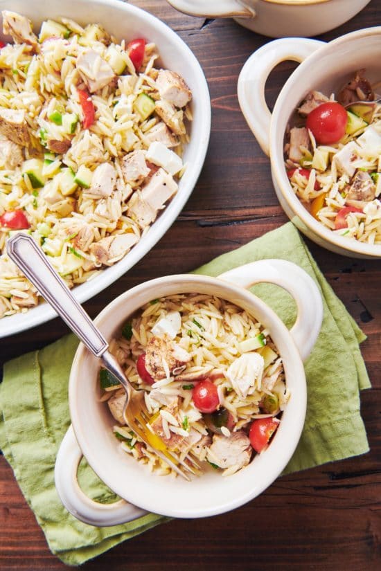 Bowls of Greek Chicken Pasta Salad on a table.