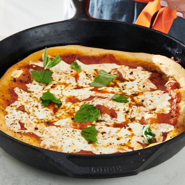 Cast Iron skillet with a Pizza.