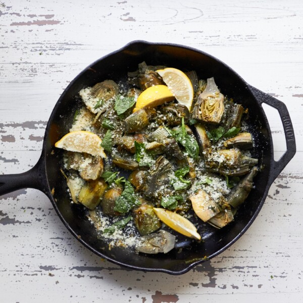 Skillet of Braised Baby Artichokes with Leeks and Capers.