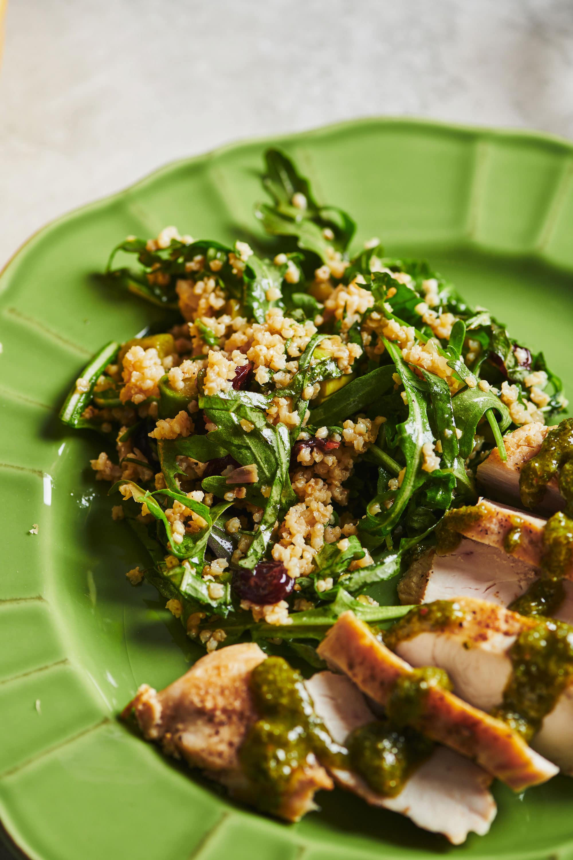 Green plate of Millet and Greens Salad.