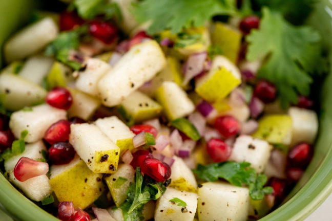 Bowl of colorful Spicy Pear and Cilantro Salsa.