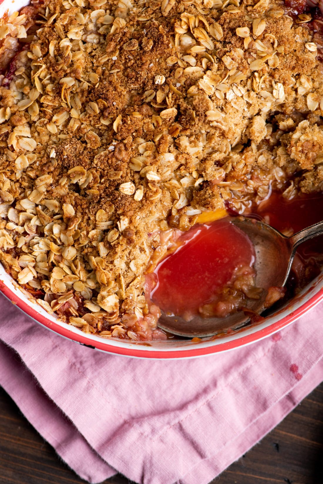 Spoon in a Dutch oven of Plum and Nectarine Crisp.
