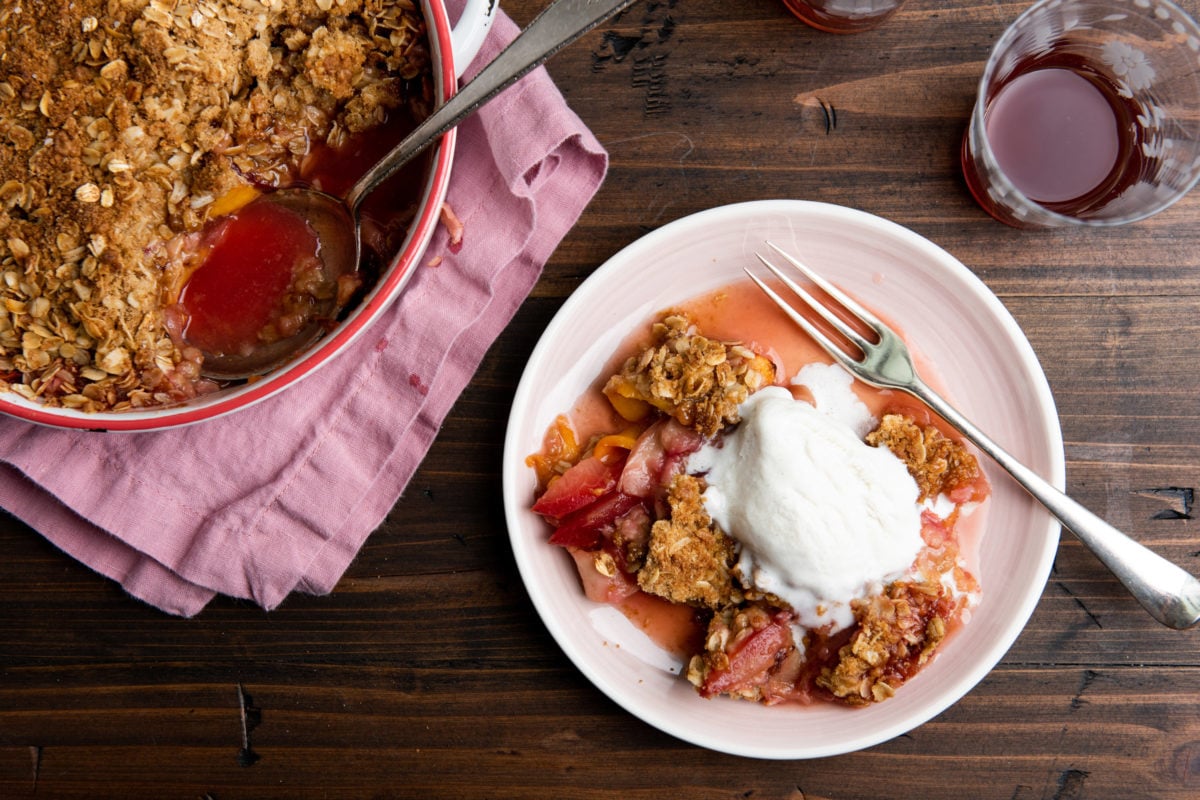 Plum and Nectarine Crisp in a Dutch oven and on a plate.