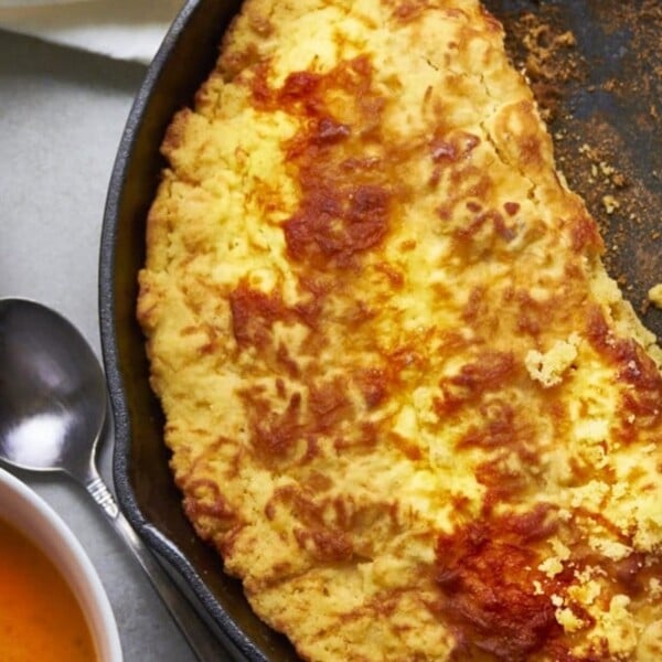 Cheddar cornbread in cast iron pan.