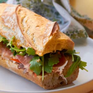 Prosciutto and Pork Banh Mi on white plate.