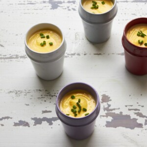 Small, differently colored cups of Butternut Squash and Fennel Soup.