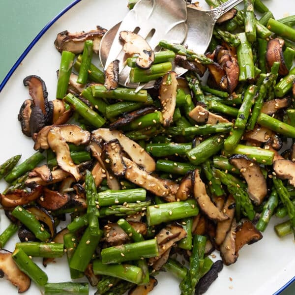 Sesame Asparagus and Shiitake Mushrooms on an oblong serving dish.