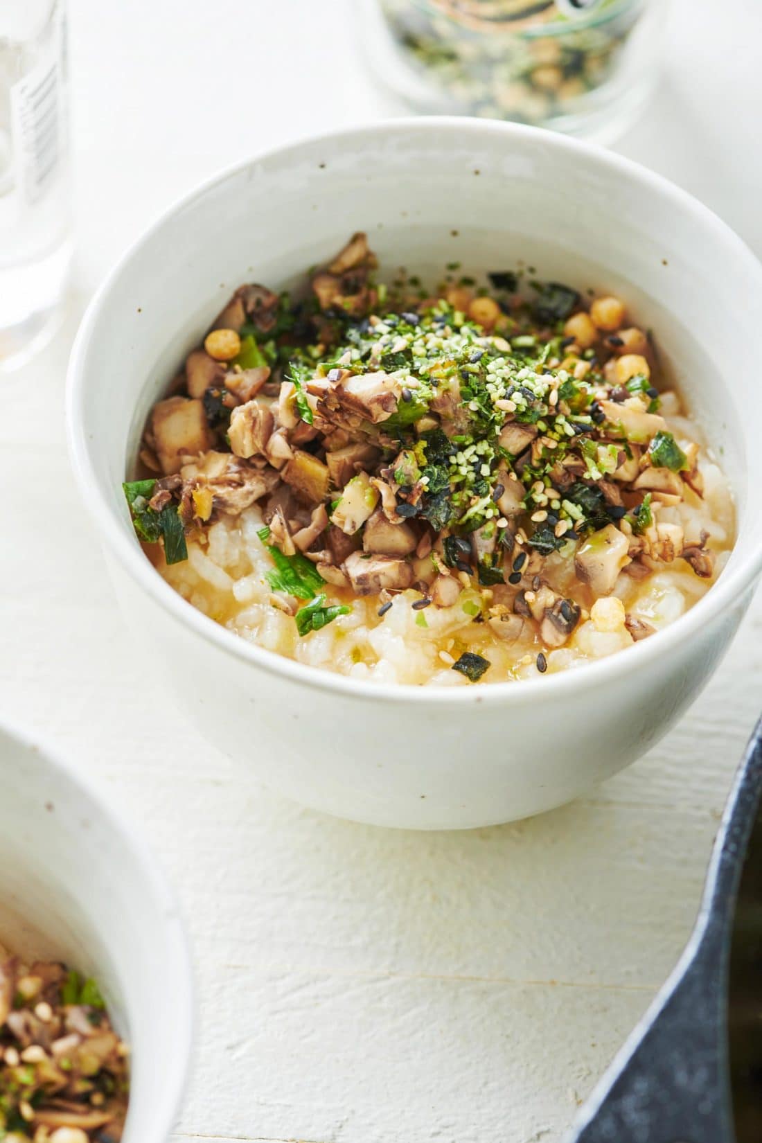 Congee (Chinese Rice Porridge) topped with mushroom mixture.