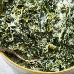 Fork in a bowl of Creamed Kale.
