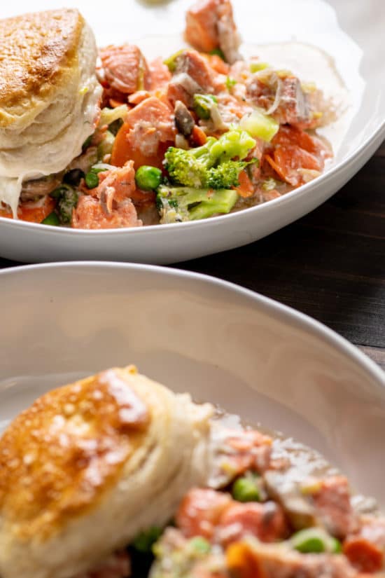 A serving of Salmon and Vegetable Biscuit Pot Pie Casserole on two plates