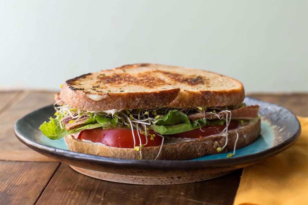 California BLT on a blue plate.