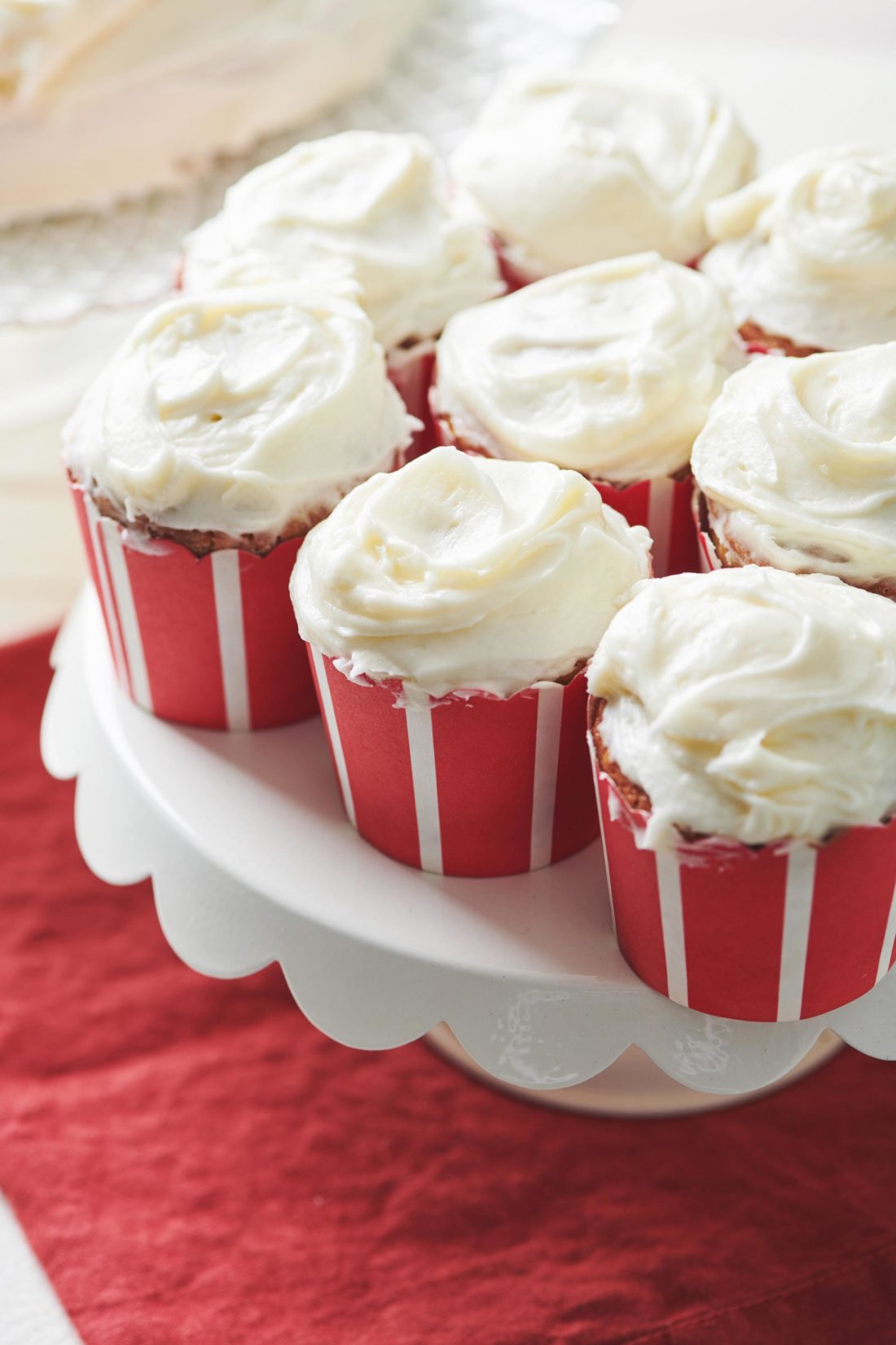 Elevated platter of Banana Cupcakes with Cream Cheese Frosting.