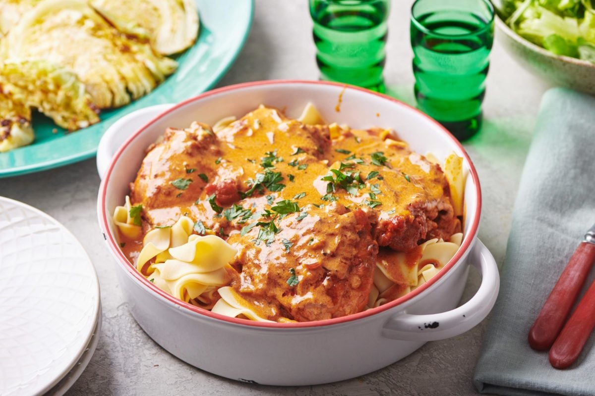 Chicken Paprikash in a handled bowl.