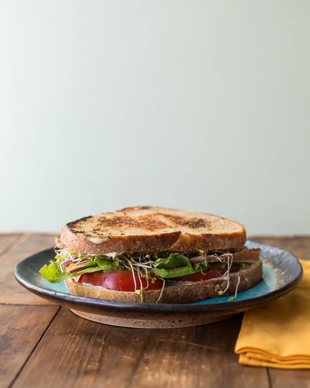 California BLT on a blue plate.