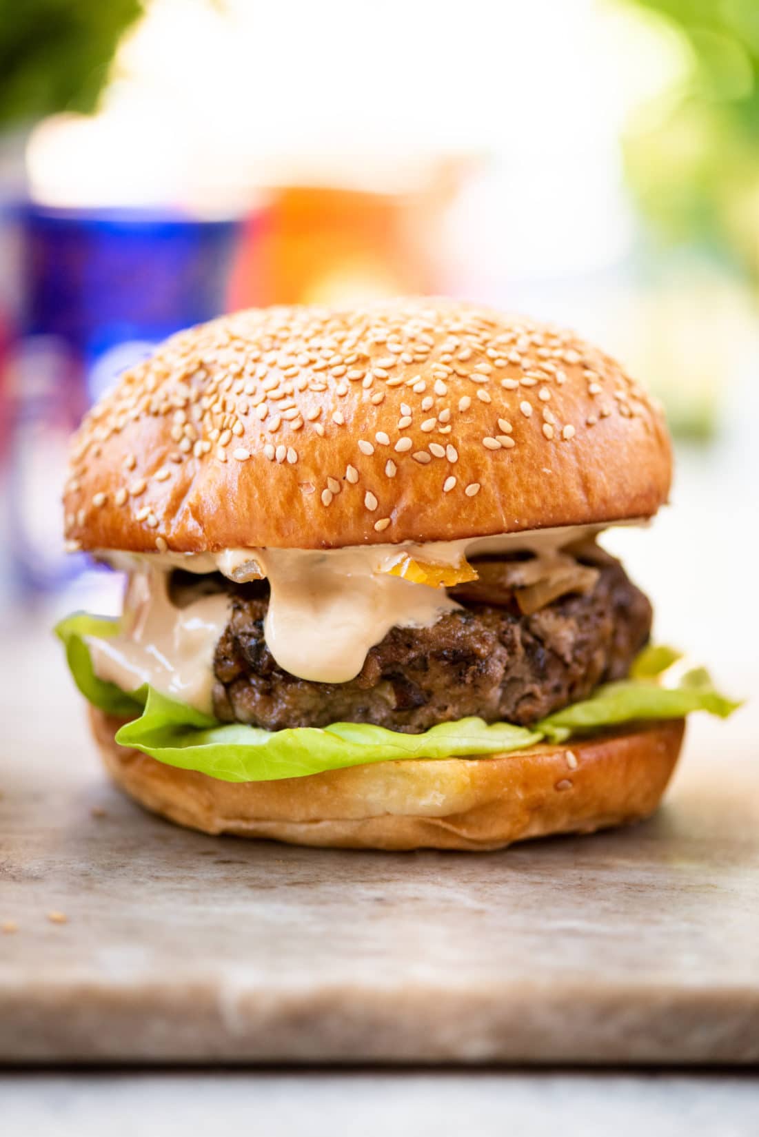 Asian beef mushroom burger on a marbled surface.